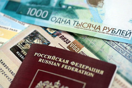 Fragment of Russian Federation visa in passport page and russian money close up. Concept of travel and tourism in Russiaの写真素材
