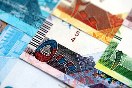 Qatari riyal money bills banknotes lies in big pile on table close up. Concept of finances and business in Qatarの写真素材