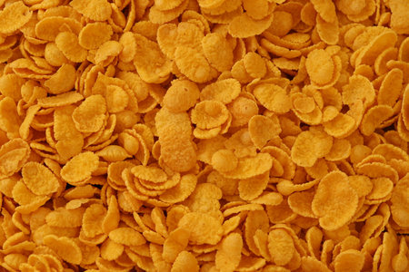 Corn flakes background and texture close up. Top view cornflake cereal box for breakfast