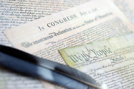 US Constitution with Declaration Of Independence and Quill Pen close up. Patriotism, Fourth of July...
