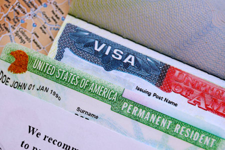 U.S. VISA United States of America. American Lottery Green Card Visa on USA map background close up