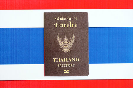 Thai passport on flag close up. The concept of citizenshipの写真素材