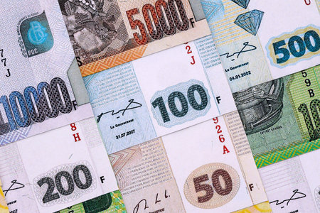 Congolese franc money bills in big amount on table close up. Rich life concept in Democratic...