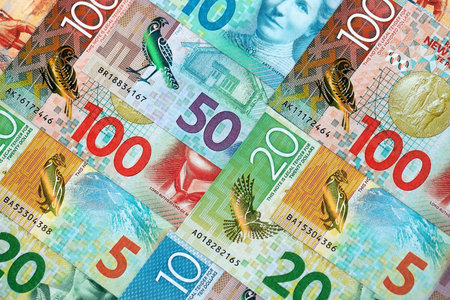 New Zealand dollar money bills in big amount on table close up. Rich life concept in New Zealand....