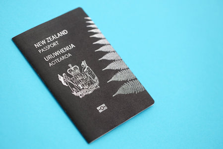 New Zealand passport on light blue background close up. Concept of travel and tourismの写真素材
