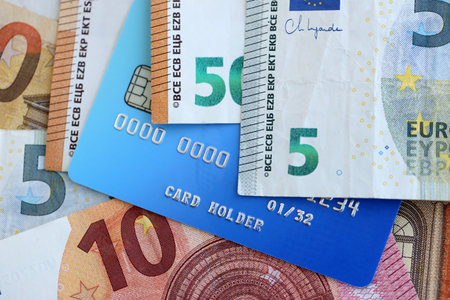 Euro money bills banknotes and credit card for cashless payments. Concept of banking service in European Union countriesの写真素材