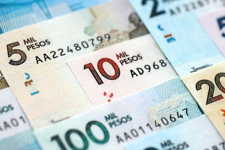 Colombian pesos money bills banknotes lies in big pile on table close up. Concept of finances and business in Colombiaの写真素材