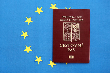 Czech biometrical passport on European Union flag background. Concept of citizenship of Czech Republicの写真素材