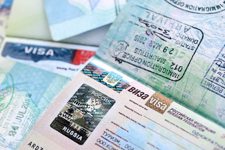 Fragment of Russian Federation visa in passport page close up. Concept of travel and tourism...