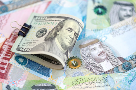 Bahraini dinar currency money bills and bunch of us dollar banknotes close up. The concept of economics and currency exchangeの写真素材