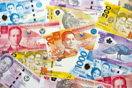 Philippines peso currency money bills. The current banknotes lies on table in big amount close upの写真素材