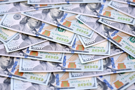 Many one hundred dollars money bills banknotes on smooth surface close up. Concept of business, rich life and economical questions in United States of America and around the worldの写真素材