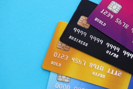 Various credit cards templates for specimen on light blue background. Concept of online banking and cashless transactions, money transfers worldwideの写真素材