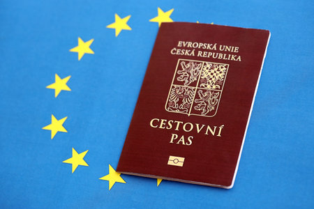 Czech biometrical passport on European Union flag background. Concept of citizenship of Czech Republicの写真素材