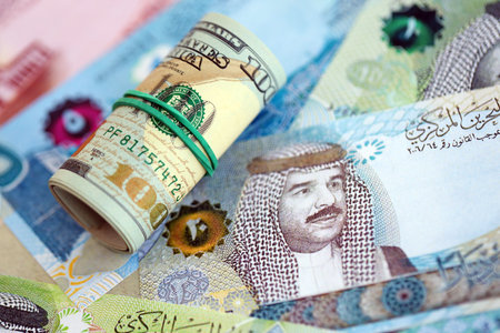 Bahraini dinar currency money bills and bunch of us dollar banknotes close up. The concept of economics and currency exchangeの写真素材
