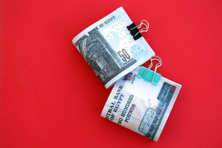 Egyptian pound money bills in big amount on red close up. Finance and banking conceptの写真素材