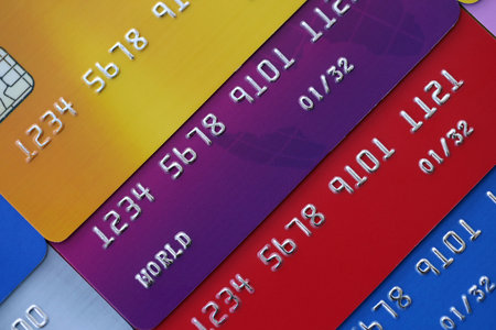Many credit or debit cards with fictional specimen numbers. Big amount of banking plastic cards of various colors. Financial concept of business and e-commerceの写真素材
