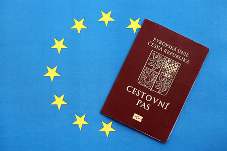 Czech biometrical passport on European Union flag background. Concept of citizenship of Czech Republicの写真素材