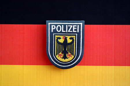 KYIV, UKRAINE - SEPTEMBER 6, 2025 Germany Police patch on national flag close upのeditorial素材