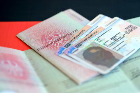 KYIV, UKRAINE - AUGUST 31, 2025 German Permanent resident card and temporary document lies on...