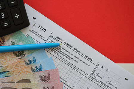 KYIV, UKRAINE - JANUARY 27, 2024 Indonesian tax form 1770 Individual Income Tax Return and pen on table close upのeditorial素材