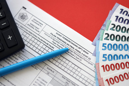 KYIV, UKRAINE - JANUARY 27, 2024 Indonesian tax form notification letter SPT for final income tax period article 4 paragraph 2 on accountant tableのeditorial素材