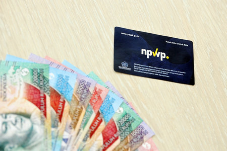 KYIV, UKRAINE - JANUARY 27, 2024 Indonesia NPWP new tax id Number card originally called Nomor Pokok Wajib Pajak. Used to carry out transactions related to taxation for Indonesian taxpayers.のeditorial素材