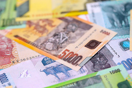 Congolese franc money bills in big amount on table close up. Rich life concept in Democratic...