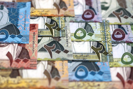 Saudi Arabia riyal money bills banknotes lies in big pile on table close up. Concept of finances and business in Saudi Arabiaの写真素材