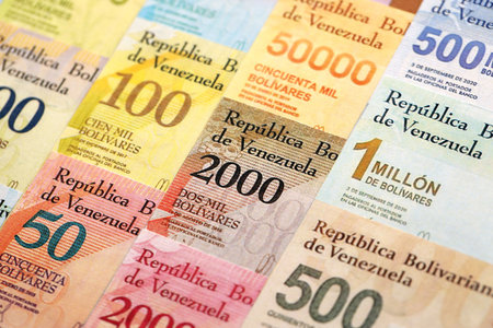 Venezuelan Bolivar currency money bills in big amount. Stack of bolivar currency banknotes with different denomination close upの写真素材