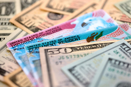 American US dollars money bills with permanent resident and employment authorization card close upの写真素材
