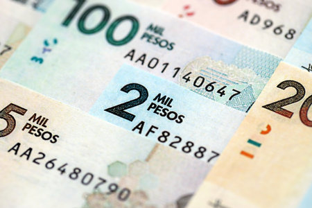 Colombian pesos money bills banknotes lies in big pile on table close up. Concept of finances and business in Colombiaの写真素材
