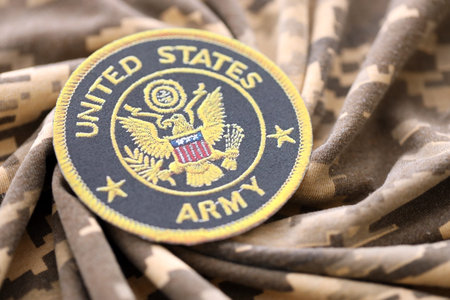 KYIV, UKRAINE - OCTOBER 7, 2025 United States Army patch on folded camouflage fabric close upのeditorial素材