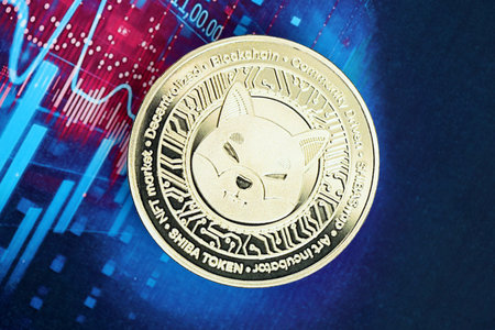 KYIV, UKRAINE - OCTOBER 9, 2025 Shibacoin cryptocurrency coin sticker on futuristic blue chart...