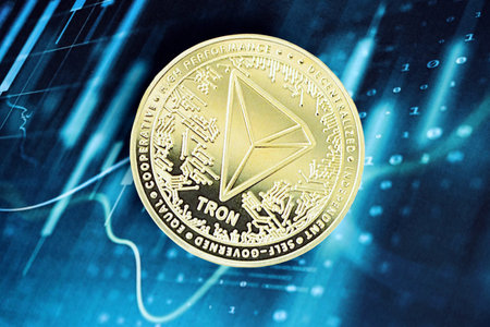KYIV, UKRAINE - OCTOBER 9, 2025 Tron cryptocurrency coin sticker on blue candles chart banner....