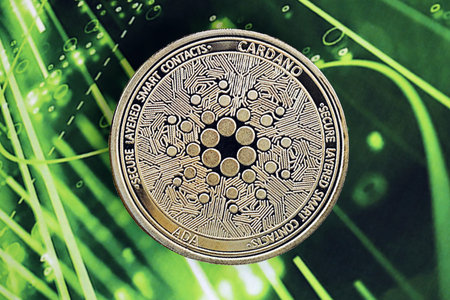 KYIV, UKRAINE - OCTOBER 9, 2025 Cardano ADA cryptocurrency coin sticker on green chart banner. Concept of modern crypto moneyのeditorial素材