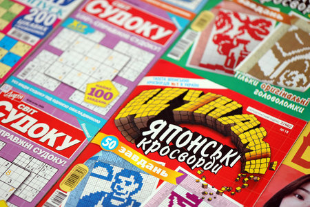 KYIV, UKRAINE - OCTOBER 18, 2025 Many magazines of japanese sudoku puzzles and crosswords on table of magazine shopのeditorial素材