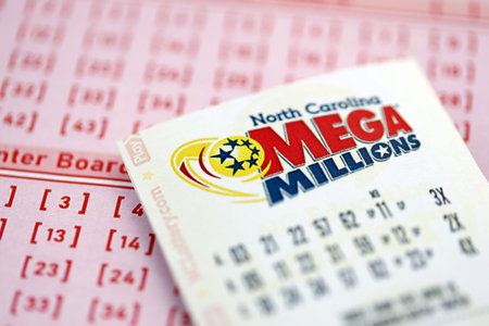 KYIV, UKRAINE - OCTOBER 22, 2025 Mega Millions lottery ticket lies on blank bill with numbers close upのeditorial素材