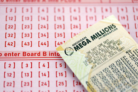 KYIV, UKRAINE - OCTOBER 22, 2025 Mega Millions lottery ticket lies on blank bill with numbers close upのeditorial素材