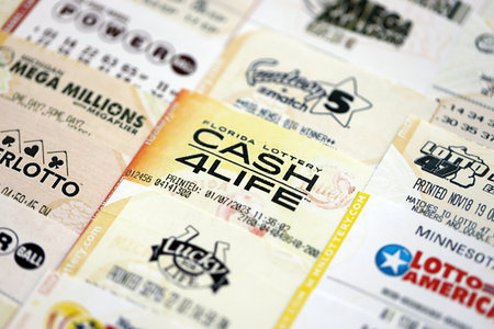 KYIV, UKRAINE - OCTOBER 22, 2025 Big amount of lottery tickets from different US lotteries with various titlesのeditorial素材