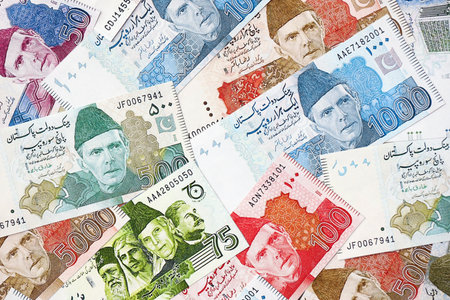 Pakistan rupees banknotes. The current Pakistan money bills lies on table in big amount. The concept of business and investment in Pakistanの写真素材