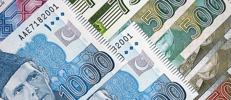 Pakistan rupees banknotes close up. The current Pakistan money bills lies on table in big amount....