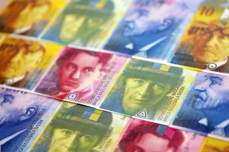 Swiss franc banknotes. The current francs money bills lies on table in big amount close up. The...