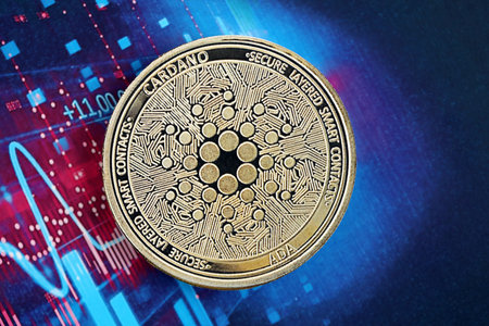KYIV, UKRAINE - OCTOBER 9, 2025 Cardano ADA cryptocurrency coin sticker on futuristic blue chart banner. Concept of modern crypto moneyのeditorial素材
