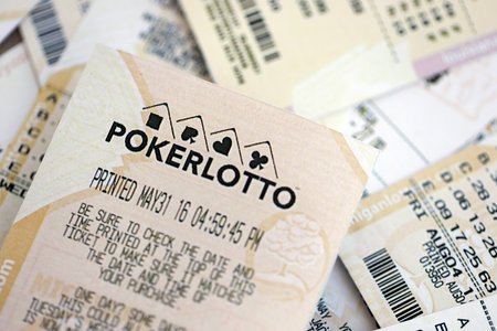 KYIV, UKRAINE - OCTOBER 22, 2025 Poker Lotto lottery ticket lies on many various lotto tickets close upのeditorial素材