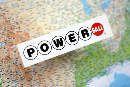 KYIV, UKRAINE - OCTOBER 22, 2025 Power Ball lottery service company logo on United States map close upのeditorial素材