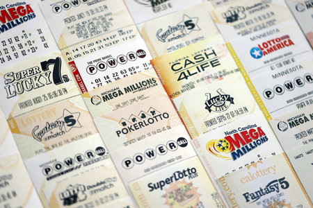 KYIV, UKRAINE - OCTOBER 22, 2025 Big amount of lottery tickets from different US lotteries with various titlesのeditorial素材