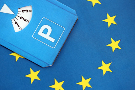 Parking disc for windshield on European Union flag. Limited time parking system in european...