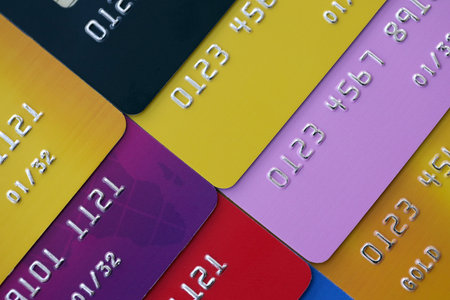 Many credit or debit cards with fictional specimen numbers. Big amount of banking plastic cards of various colors. Financial concept of business and e-commerceの写真素材