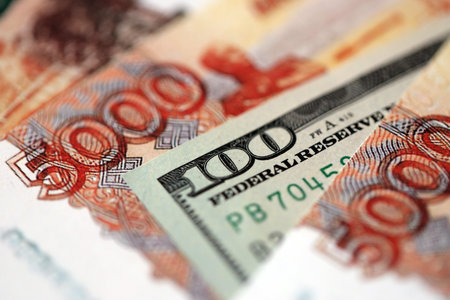 Russian rubles money bills and hundred US dollar bill banknote close up. Currency exchange between...